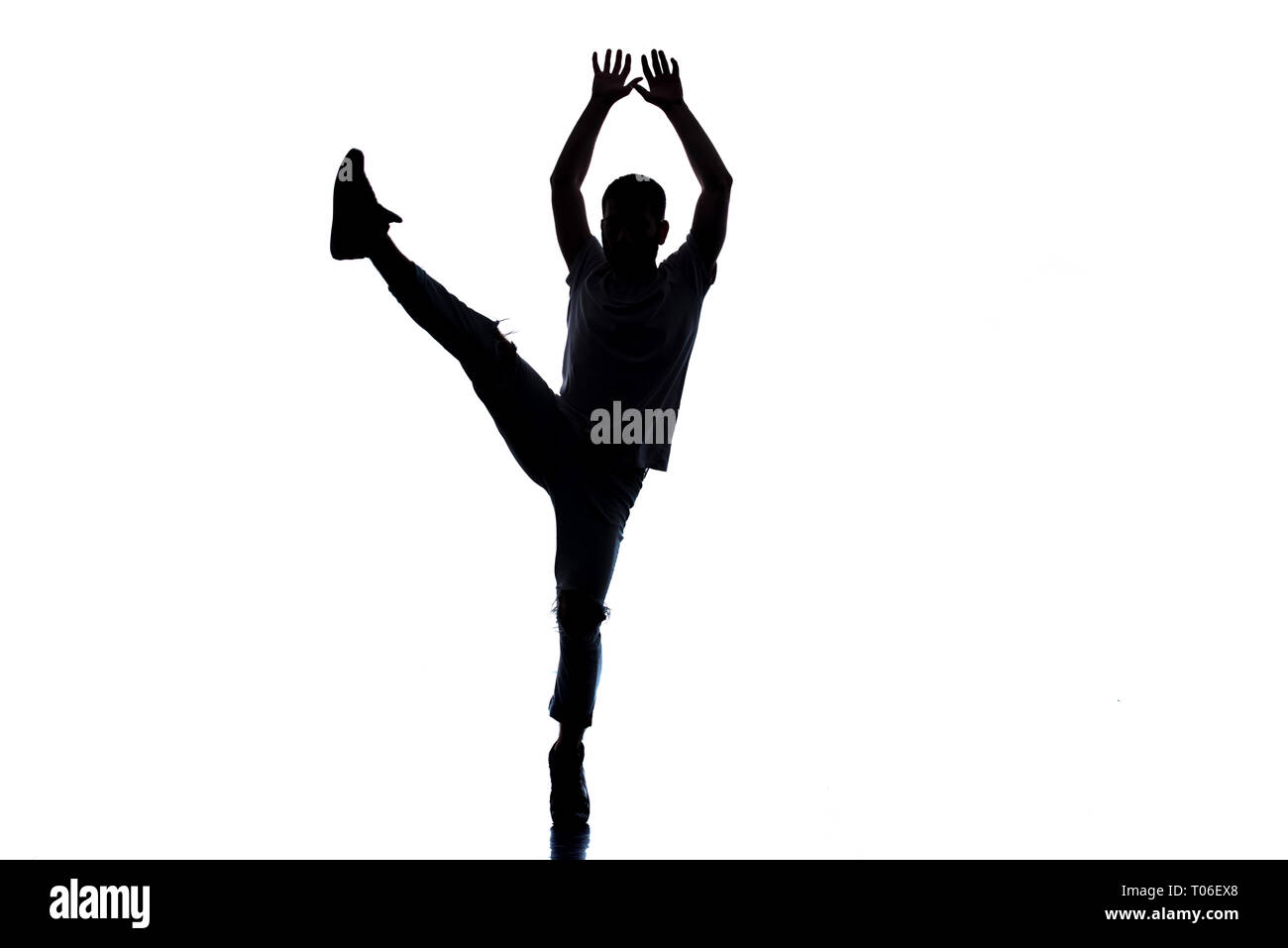 Dancer doing breakdance on white background Stock Photo