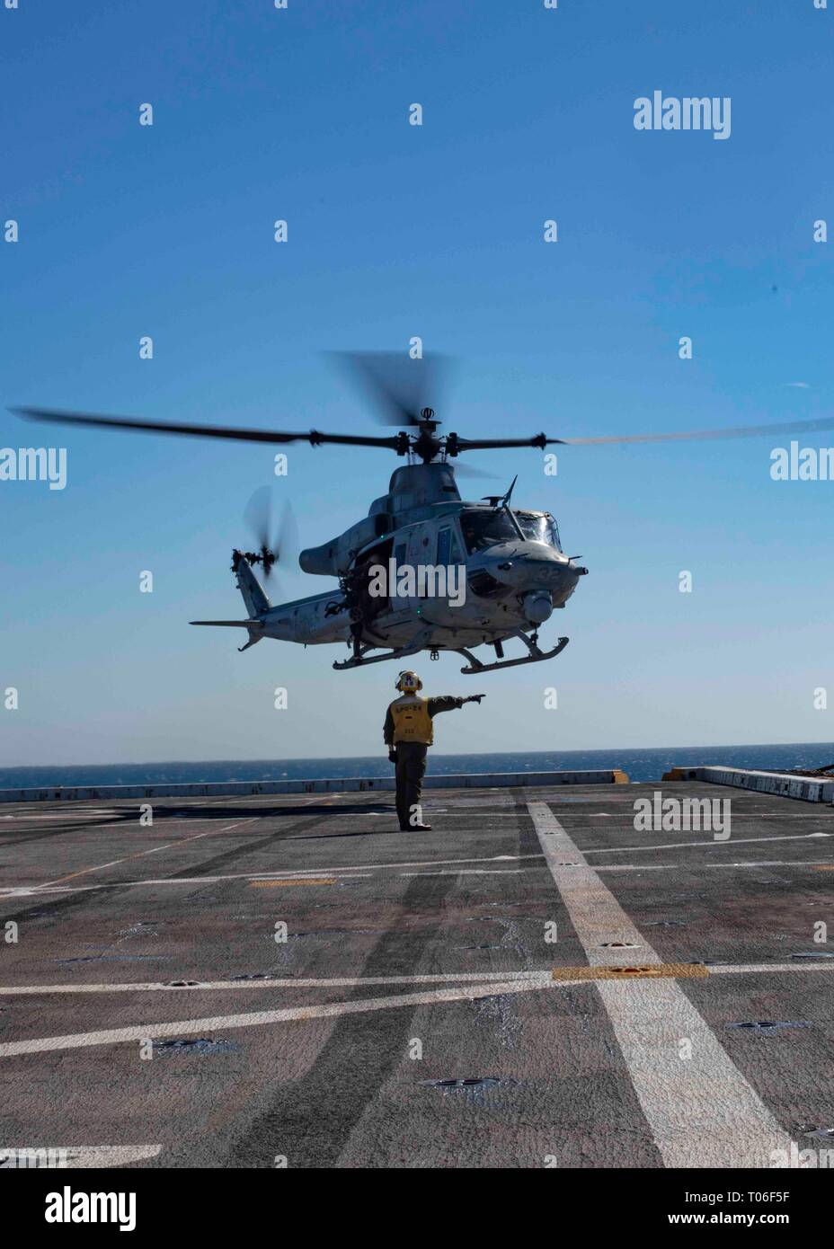 190315-N-HG389-0025 MEDITERRANEAN SEA (Mar. 15, 2019) A UH-1Y Huey helicopter assigned to the “Black Knights” of Marine Medium Tiltrotor Squadron (VMM) 264 (Reinforced) departs the flight deck of the San Antonio-class amphibious transport dock ship USS Arlington (LPD 24), Mar. 15, 2019. Arlington is on a scheduled deployment as part of the Kearsarge Amphibious Ready Group in support of maritime security operations, crisis response and theater security cooperation, while also providing a forward naval presence. (U.S. Navy photo by Mass Communication Specialist 2nd Class Brandon Parker/Released) Stock Photo