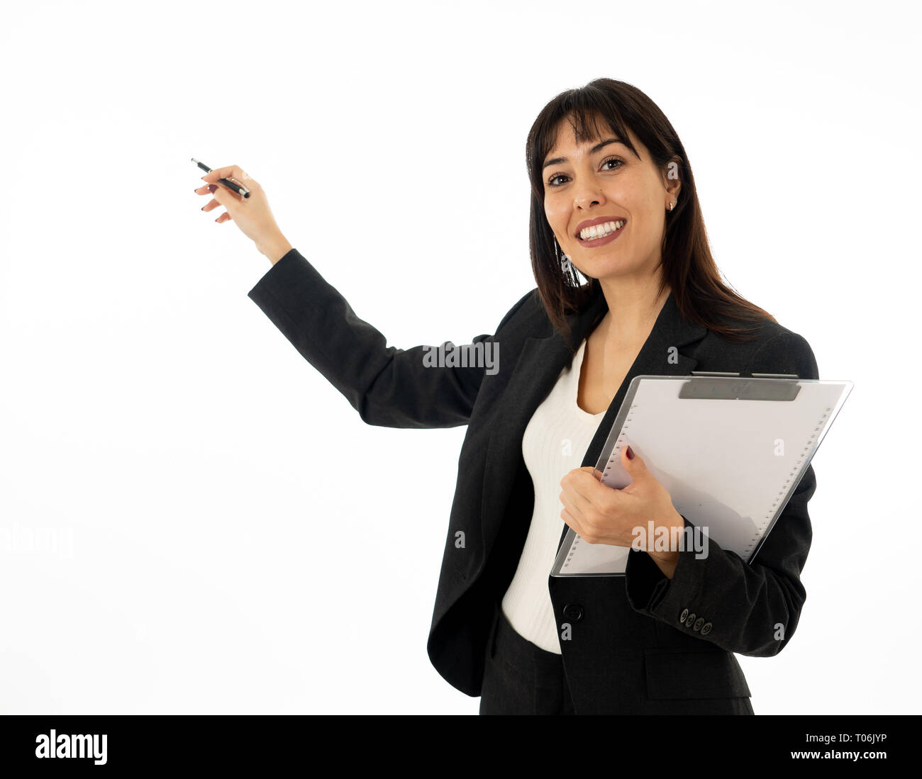 Portrait of young pretty confident businesswoman with folder showing and pointing at copy space as in a conference or Marketing business. In People, e Stock Photo