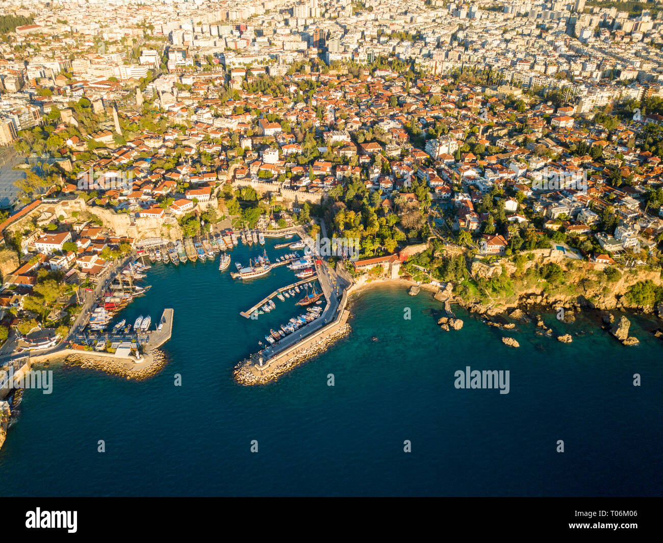 Aerial drone view down on Kaleici old town harbor and Hidirlik Castle in Antalya, Turkey Stock Photo