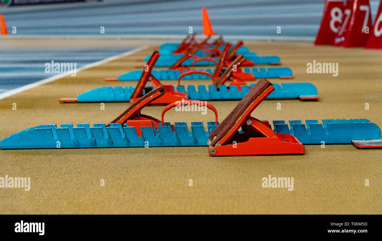 Action packed image; the starting blocks for a sprint run on a track
