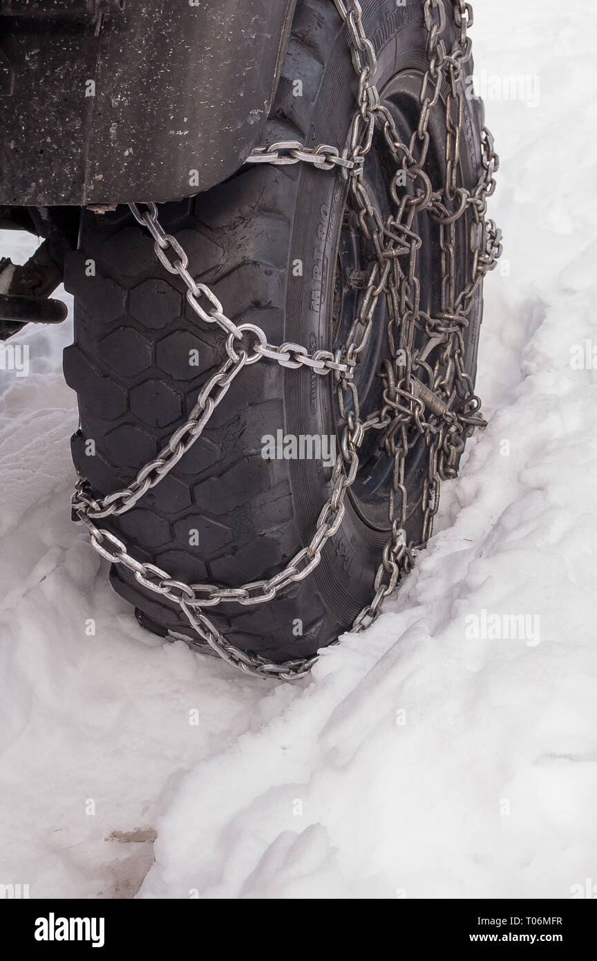 tire with snow chains Stock Photo Alamy