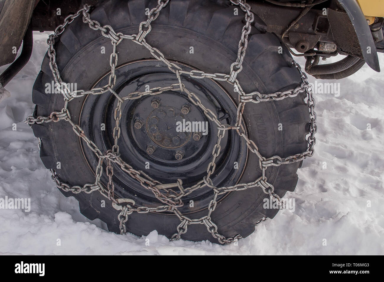 tire with snow chains Stock Photo Alamy