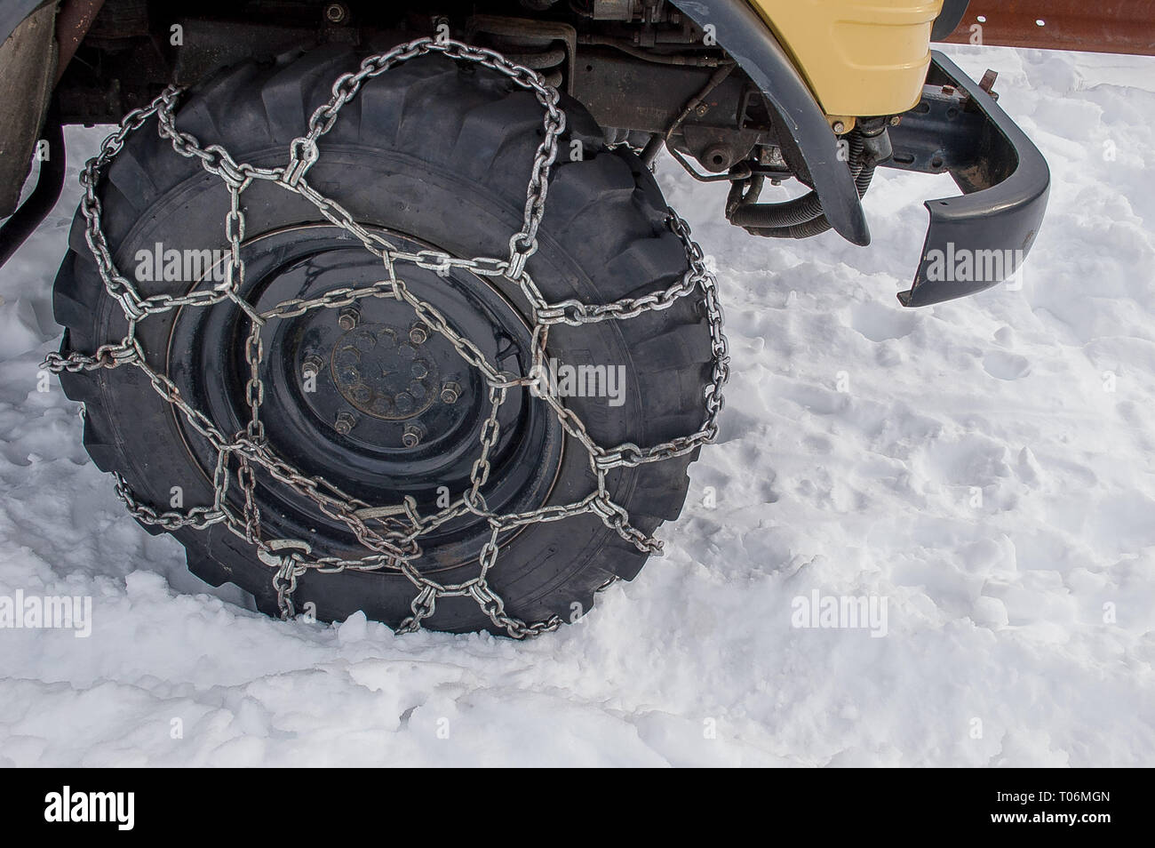 tire with snow chains Stock Photo Alamy