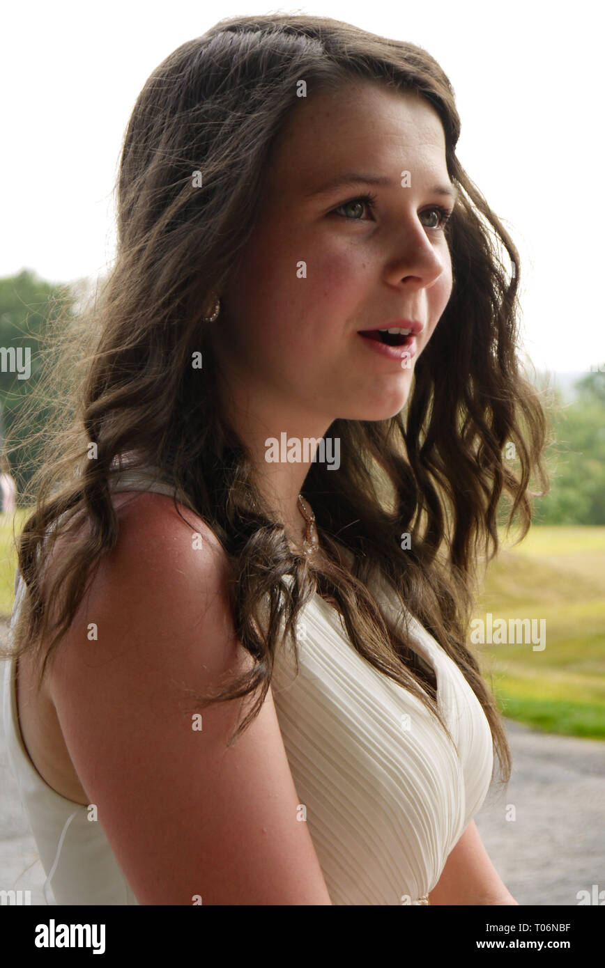 Young girl at a prom in a white dress, UK Stock Photo