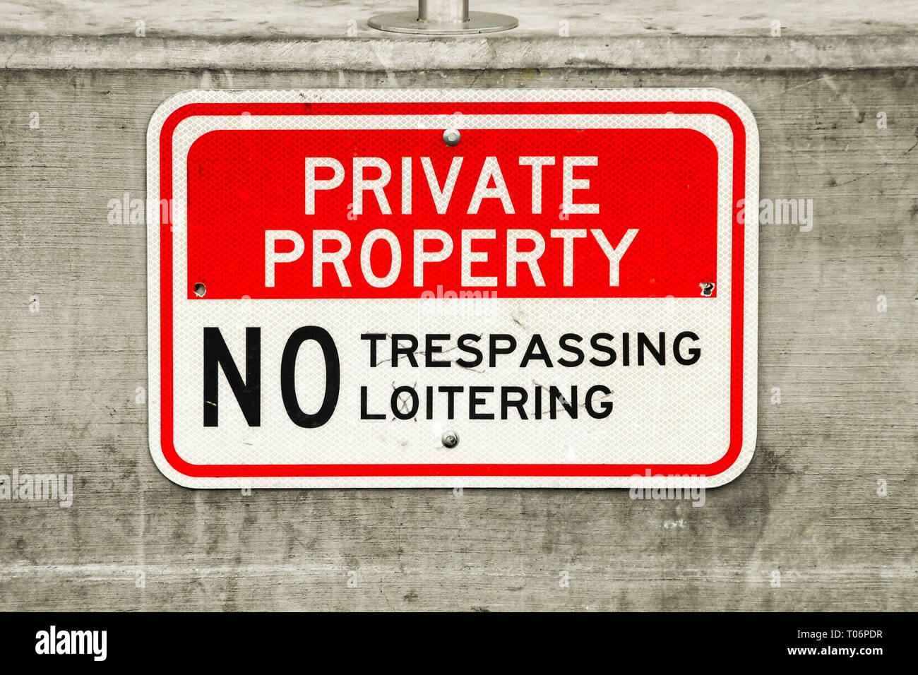 LAS VEGAS, NV, USA - FEBRUARY 2019: Close up view of a 'Private property - No Trespassing or Loitering' sign on a sidewalk on the Las Vegas Strip. Stock Photo