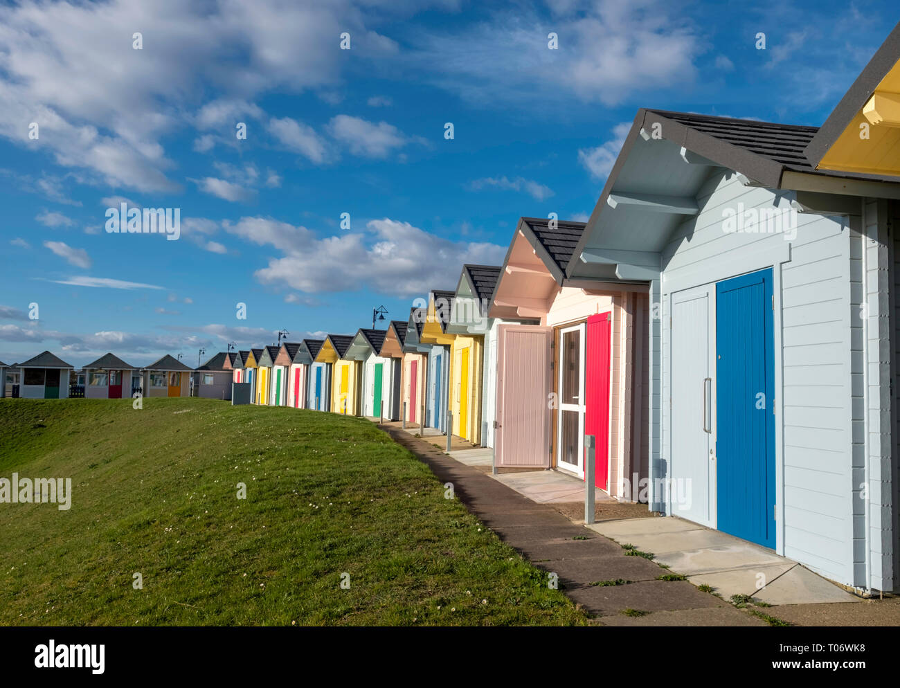 Group of painted Beach Huts on the coast at Mablethorpe, Lincolnshire. Stock Photo