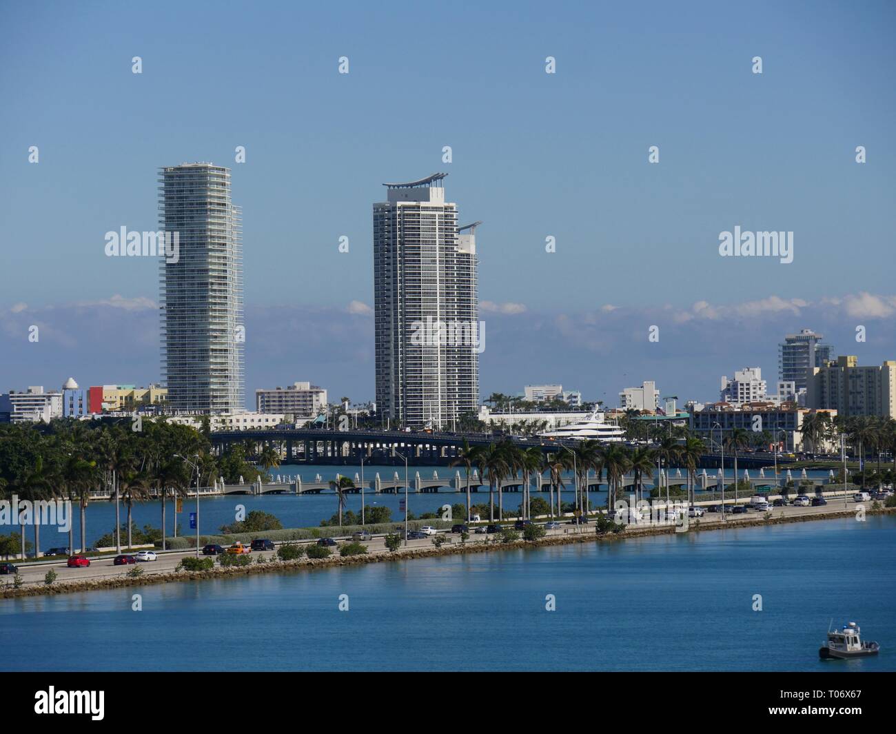 MIAMI, FLORIDA—JANUARY 2018: High rise buildings and vehicles crossing ...