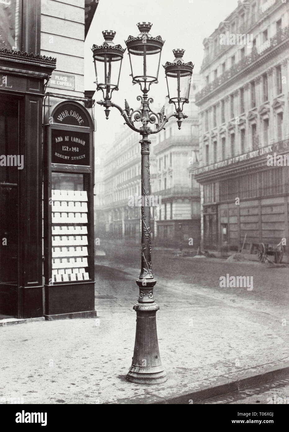 Oudry style lamp stand with three lamps on a street corner in Paris, near Place de l'Opera, Paris, France. Stock Photo