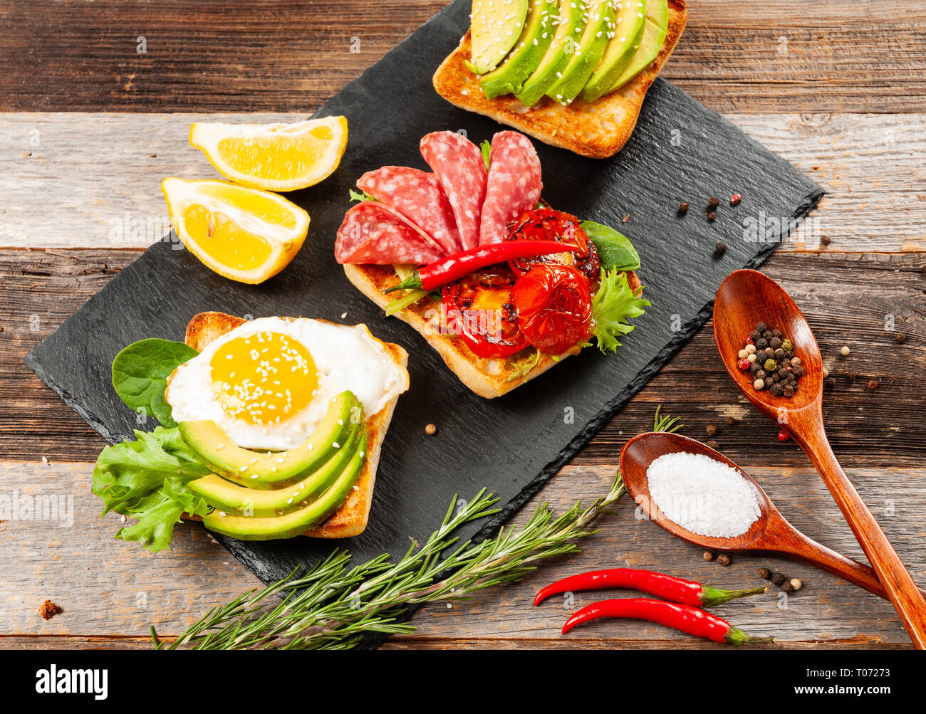 Healthy Breakfast. Fresh sandwiches. Toasts with fried egg, salami and