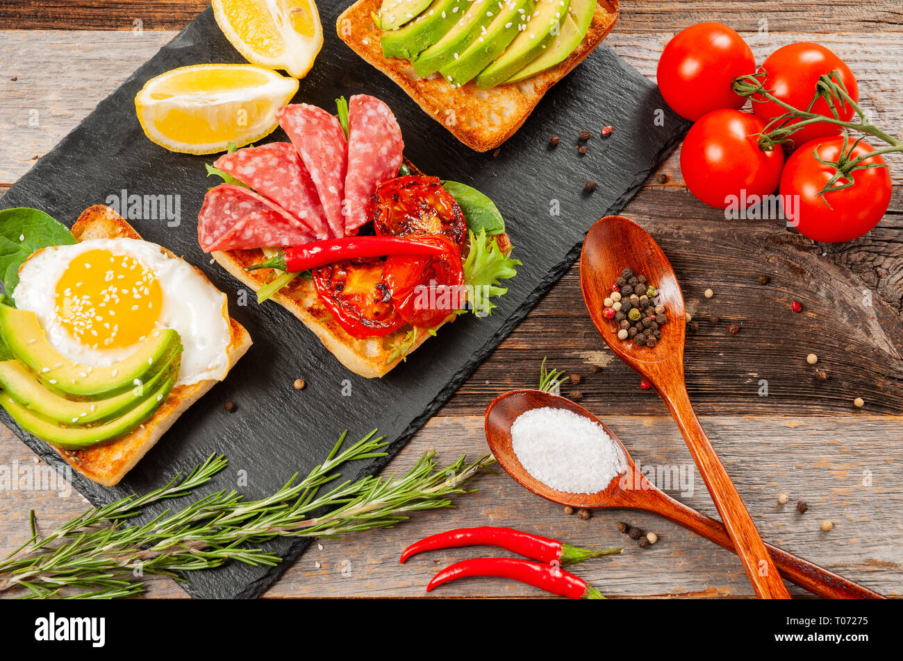 Healthy Breakfast. Fresh sandwiches. Toasts with fried egg, salami and