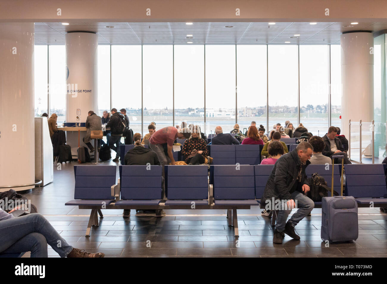 Waiting area at a terminal at Bologna airport, Italy Stock Photo Alamy