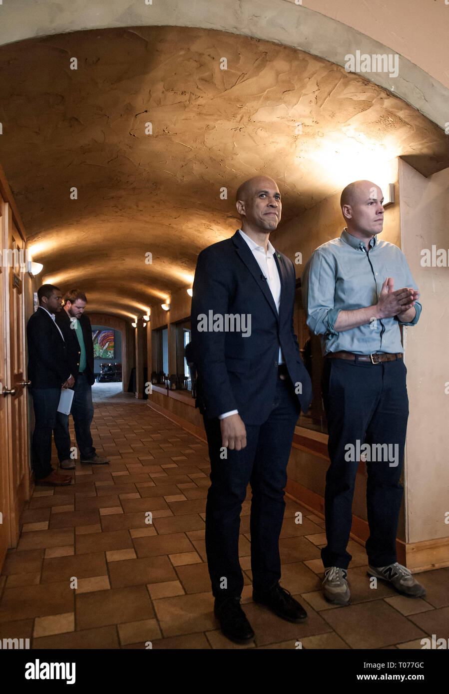 Ames, Iowa, USA. 17th Mar, 2019. Democratic presidential candidate, U.S. Senator CORY BOOKER (D-NJ), and JD SCHOLTEN listen as they are introduced during a Conversation with Cory and meet and greet with Iowa voters at the Prairie Moon Winery. Credit: Brian Cahn/ZUMA Wire/Alamy Live News Stock Photo