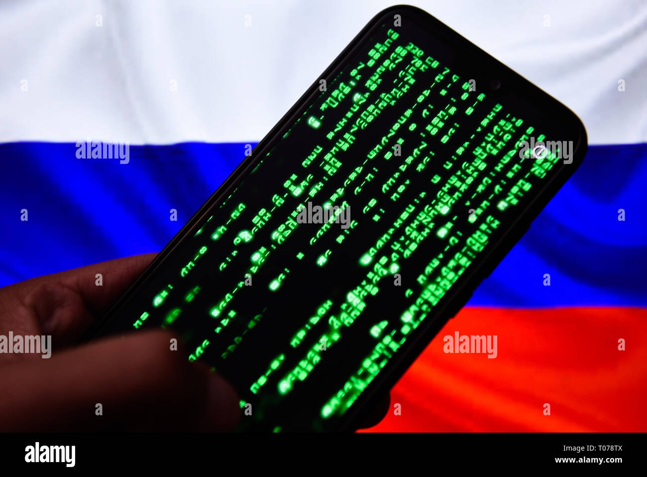 Matrix code is seen on an android mobile phone with Russia flag on the  background Stock Photo - Alamy