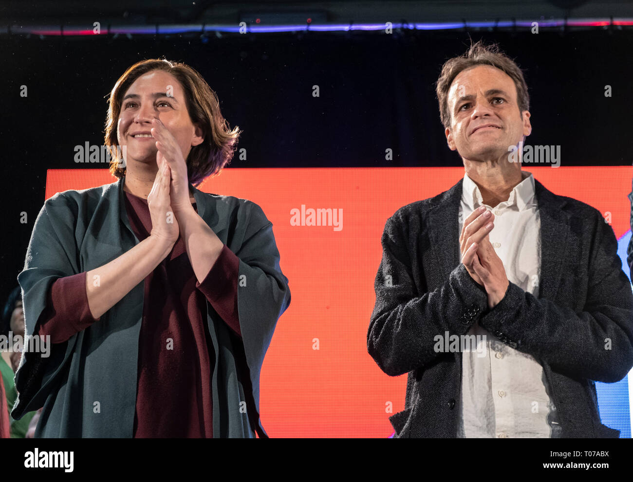Ada Colau and Jaume Asens are seen on stage during the campaign event. More than a thousand people have filled the centre of Les Cotxeres in the popular neighbourhood of Sant to support the electoral campaign of Barcelona in Comú of which the mayor Ada Colau is head of the list. Stock Photo