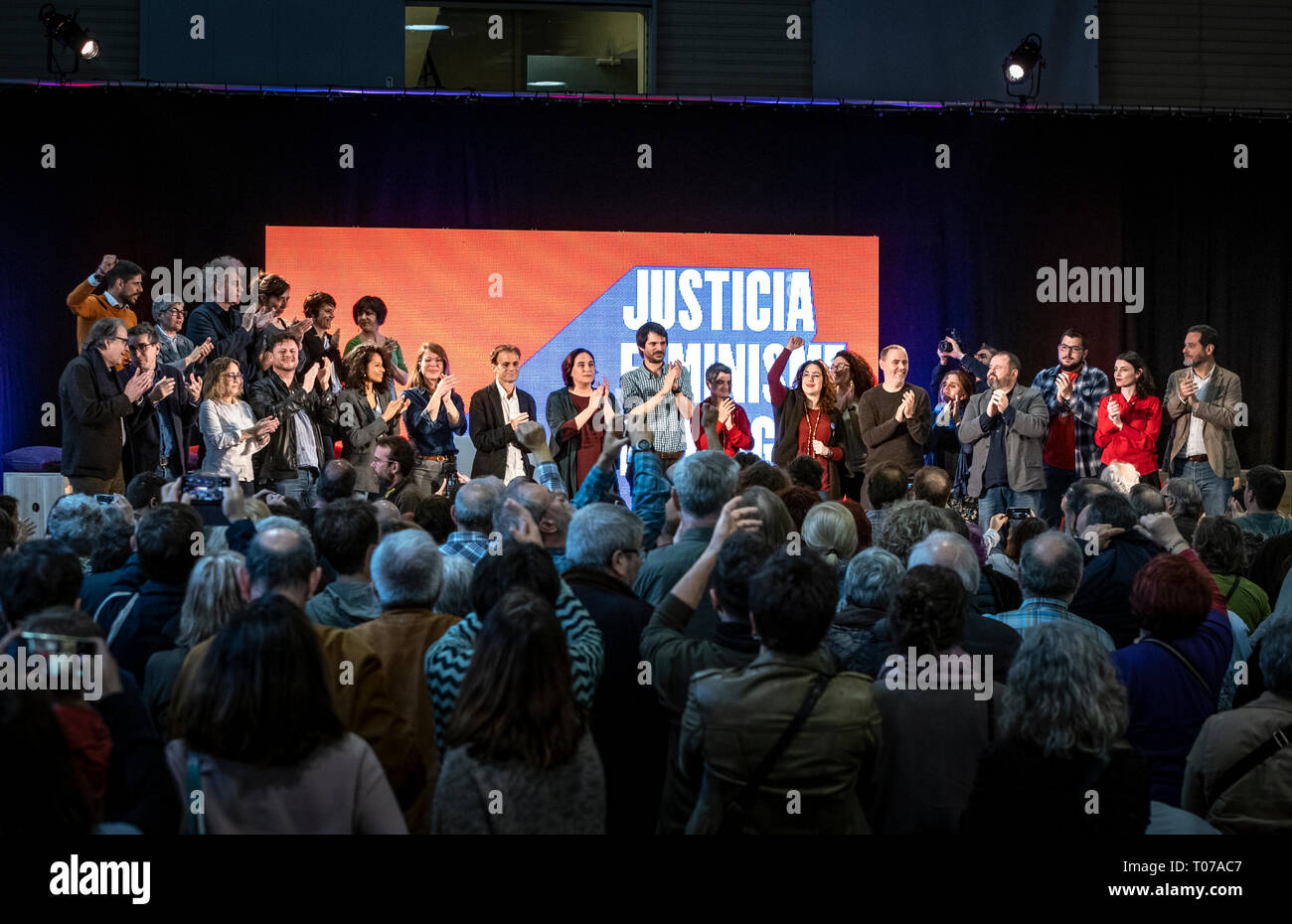 The entire group of candidates is seen on stage applauding the public during the event. More than a thousand people have filled the centre of Les Cotxeres in the popular neighbourhood of Sant to support the electoral campaign of Barcelona in Comú of which the mayor Ada Colau is head of the list. Stock Photo