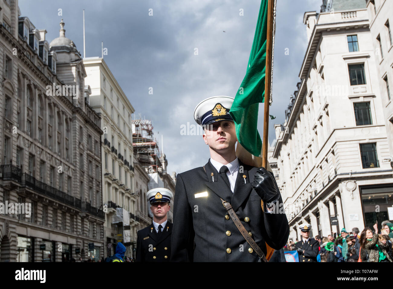 An Irish navy soldier seen with an Irish flag during the parade. The