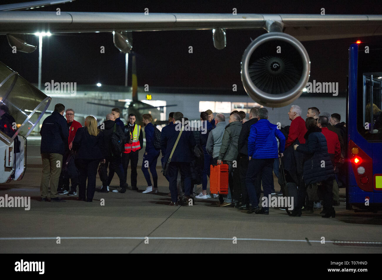 Glasgow, UK. 18 March 2019. The Scotland Football Team seen boarding their luxury jetliner private aircraft in the early hours seen  at Glasgow Airport moments before departing for Kazakhstan to play a game on Wednesday.  The flight was due to take off at 11pm, however due to an unforeseen problem where the pilot had to come out of the flight deck and onto the tarmac and speak with ground crew, the flight eventually took off in the early hours of today. Credit: Colin Fisher/Alamy Live News Stock Photo