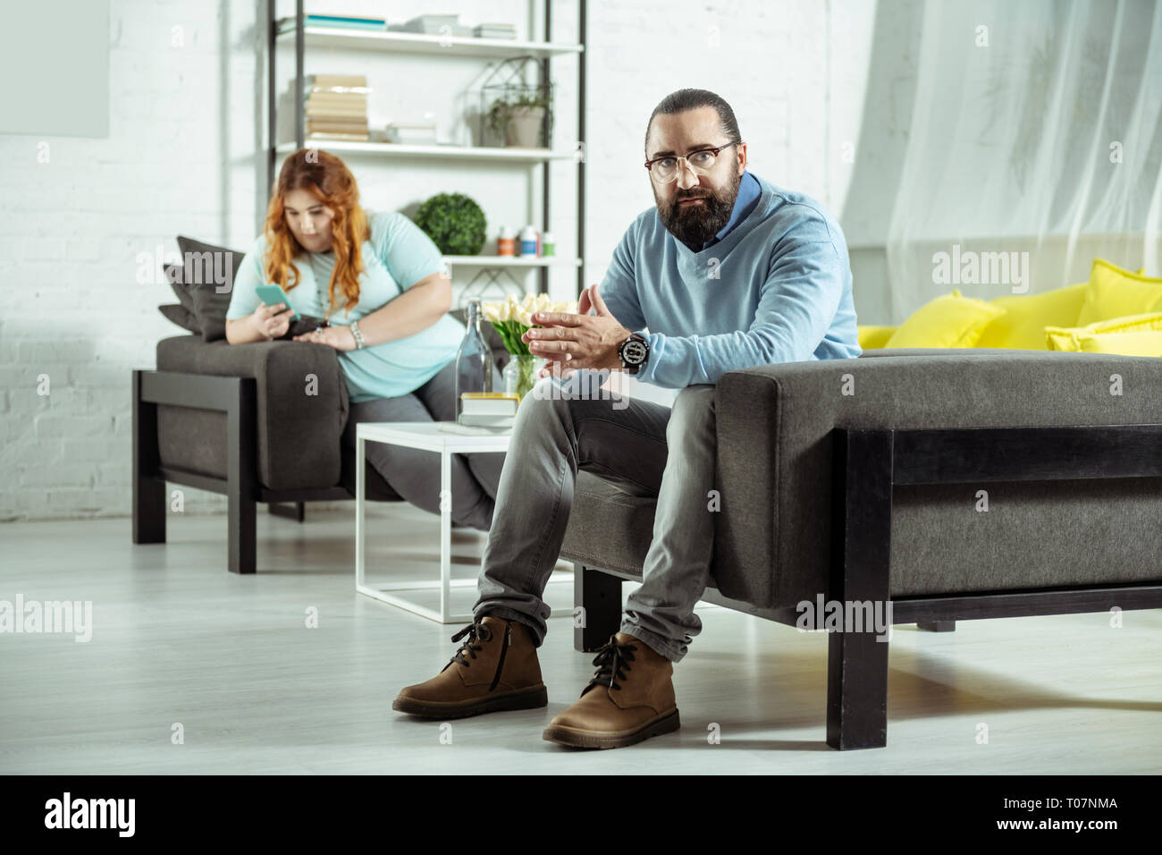 Serious Bearded Male Person Looking Straight At Camera Stock