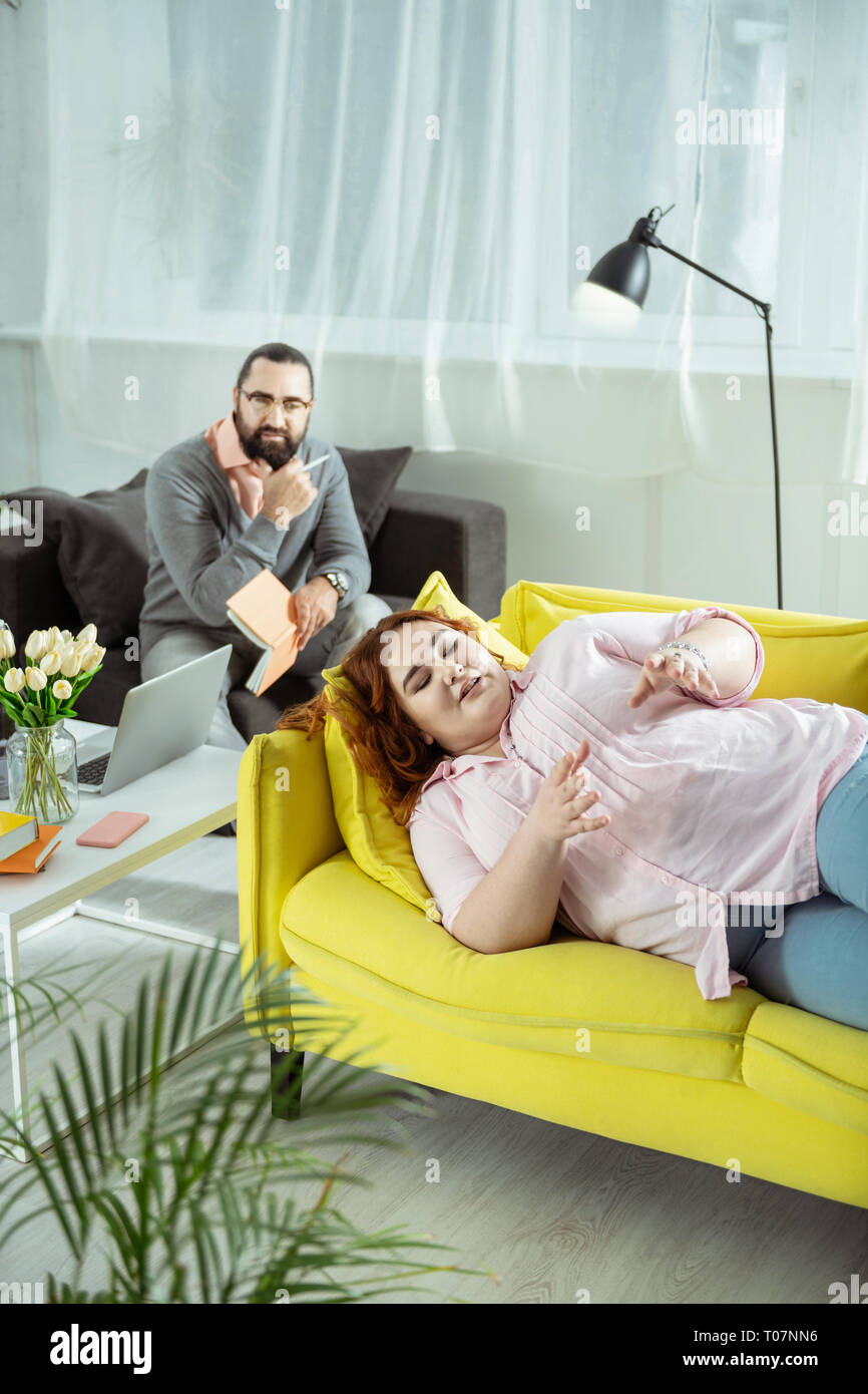 Positive delighted female person talking about her feelings Stock Photo Alamy