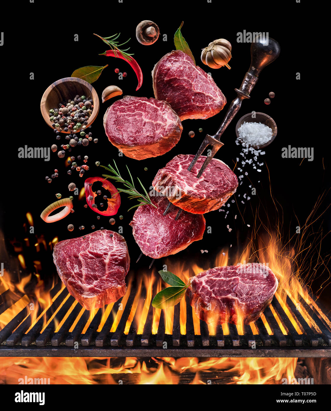 Steak ribeye cooking. Conceptual picture. Steak with spices and cutlery