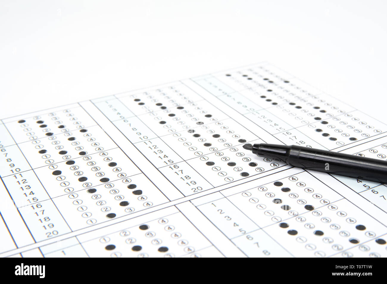 Man is filling OMR sheet handing with pen Stock Photo Alamy