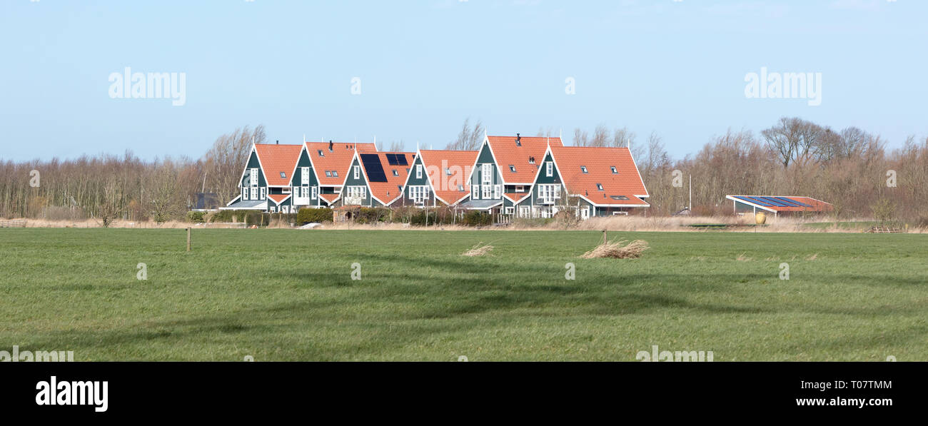 Six old houses in the Netherlands, typical dutch landscape Stock Photo