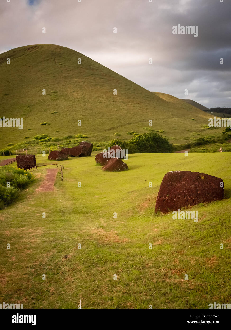Pukaos quarry in Easter Island, the hats of the moais. Landscape and detail of the red hats of the moais in the quarry Stock Photo