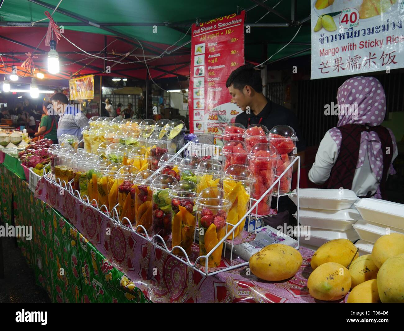 CHIANG MAI, THAILAND—MARCH 2018 Fresh sliced fruit displays for sale