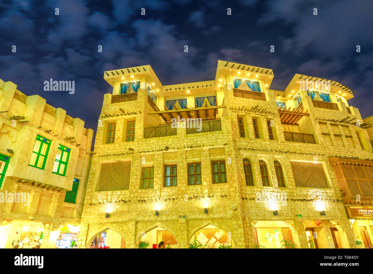Doha, Qatar - February 18, 2019: historic building at Souq Waqif, old market in traditional Qatari architectural style at night. The souq is Stock Photo