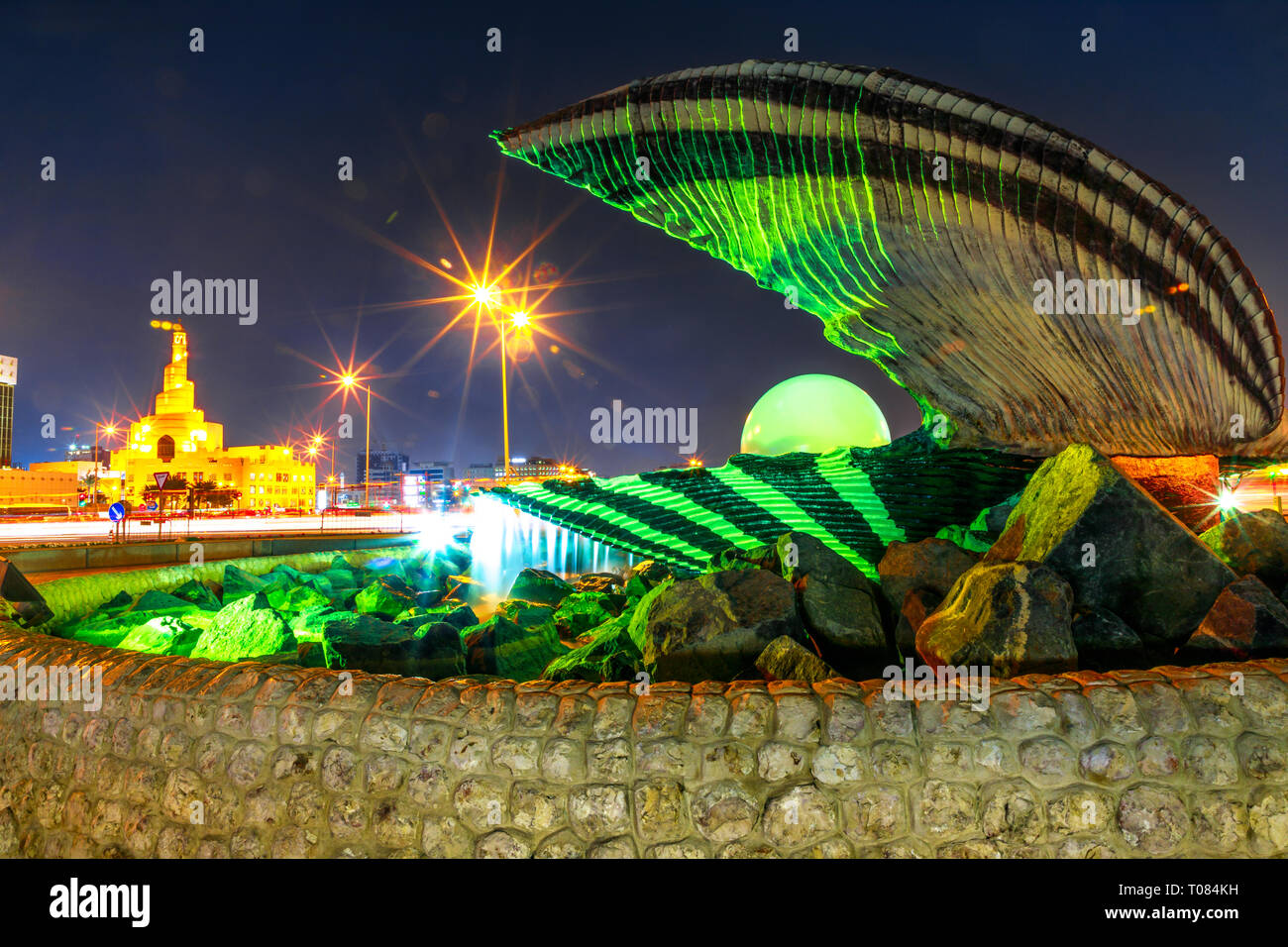 Doha, Qatar - February 23, 2019: closeup of famous Oyster and Pearl Monument with fountain on Corniche at beginning of Dhow Harbor. Fanar Islamic Stock Photo