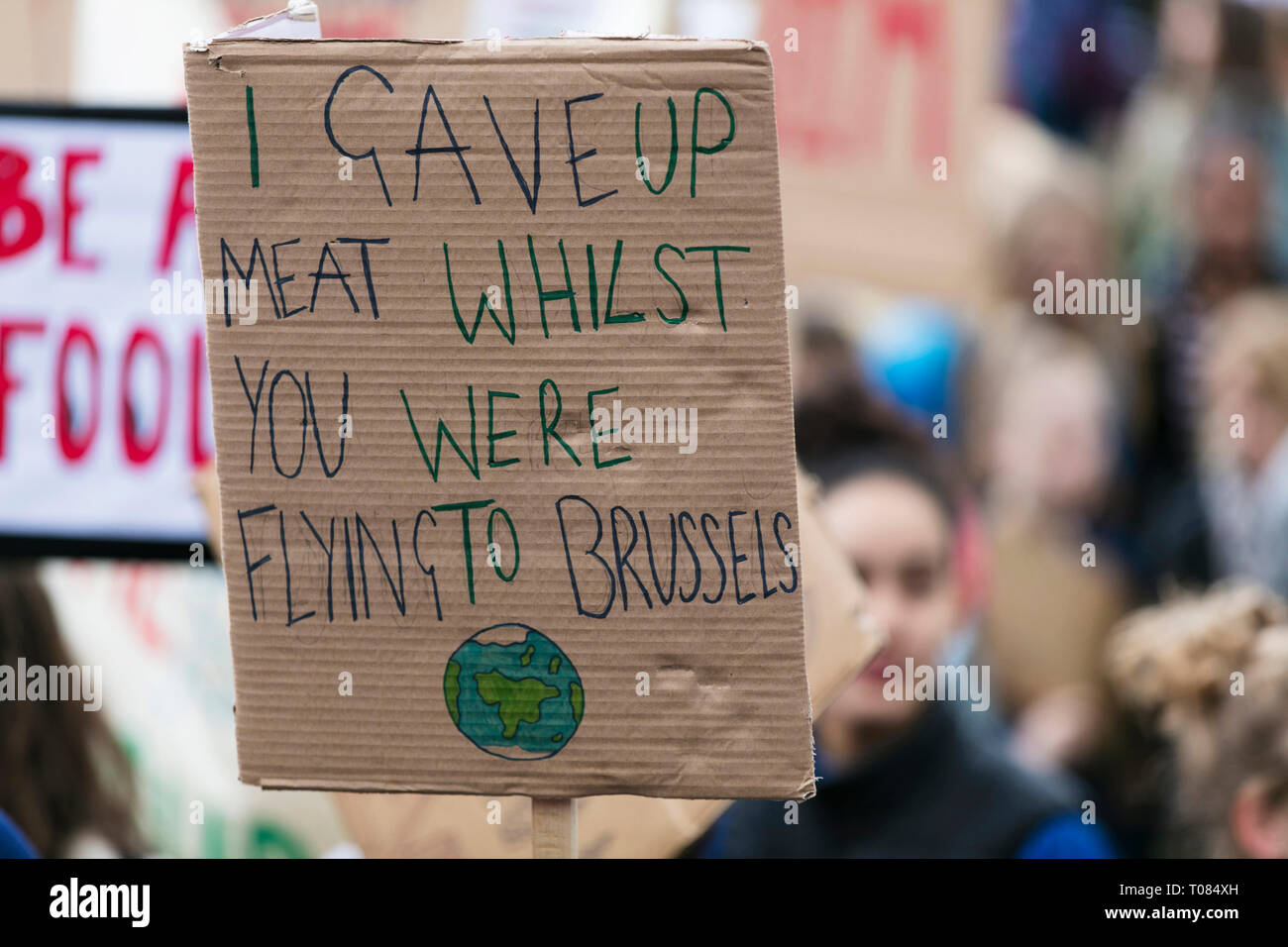 People with banners protest as part of a climate change march Stock Photo