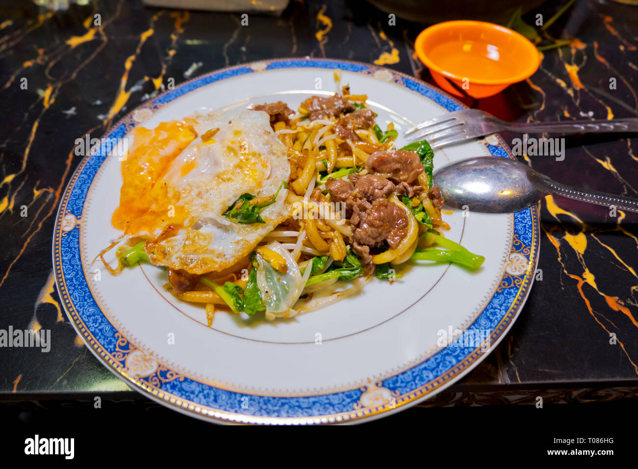 Noodle dish with beef and egg, Russian Market, Phnom Penh, Cambodia, Asia Stock Photo