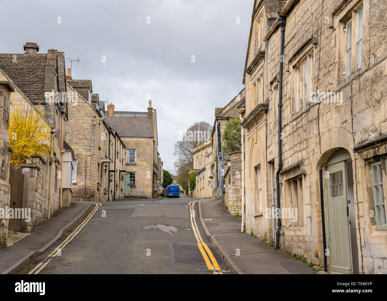 Narrow streets of Painswick known as the Queen of the Cotswolds. Houses mainly built from the honey coloured Cotswold Stone. United Kingdom Stock Photo
