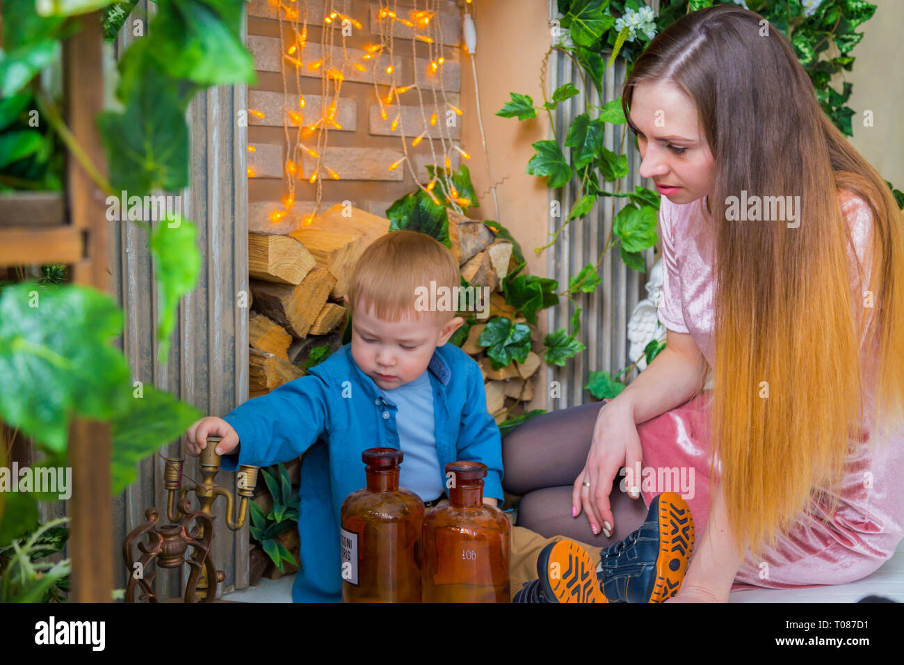 Young mother and her baby son playing togerher at home Stock Photo