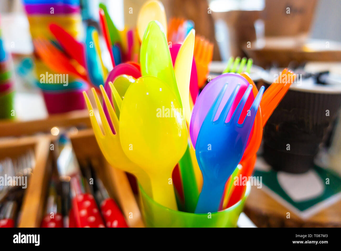 Colourful child safe plastic cutlery Stock Photo Alamy