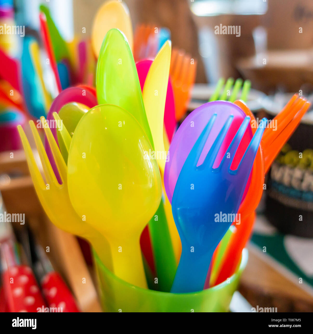 Colourful child safe plastic cutlery Stock Photo