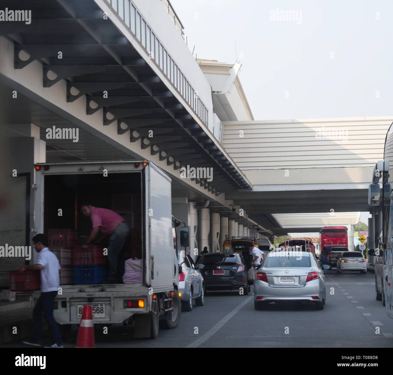 CHIANG MAI, THAILAND —MARCH 2018 A delivery truck unloads supplies outside the Chiang Mai