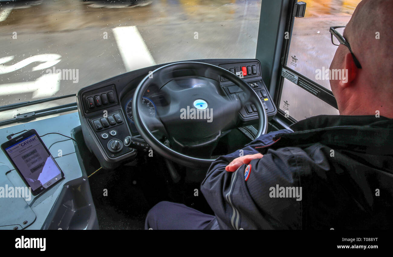 Stagecoach bus driver Dennis Finnegan demonstrates a 'driverless' bus at the Stagecoach depot in Sharston, Manchester. Stock Photo