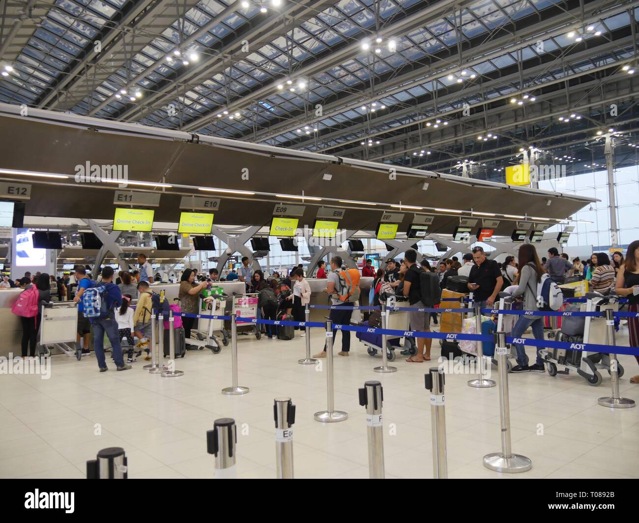 BANGKOK, THAILAND—MARCH 2018 Passengers fall in line at the checkin