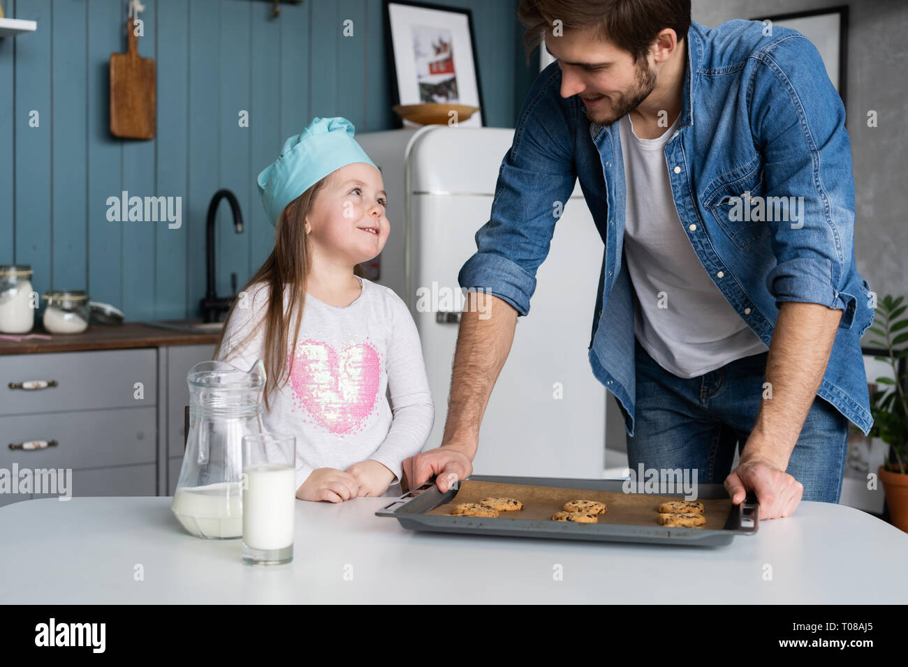 father and daughter making cookies in kitchen Stock Photo - Alamy