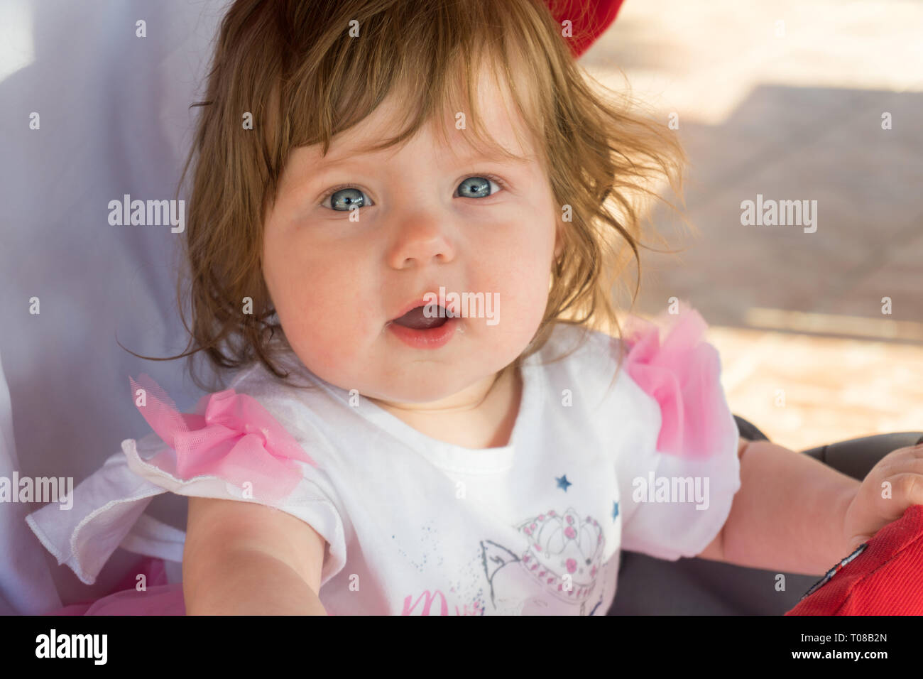 Portrait of cute baby in carriage on resort Stock Photo