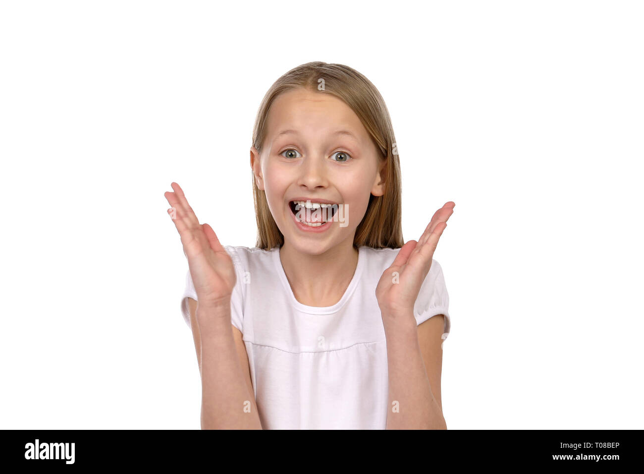 Happy blond girl smiles and raises her hands Stock Photo - Alamy