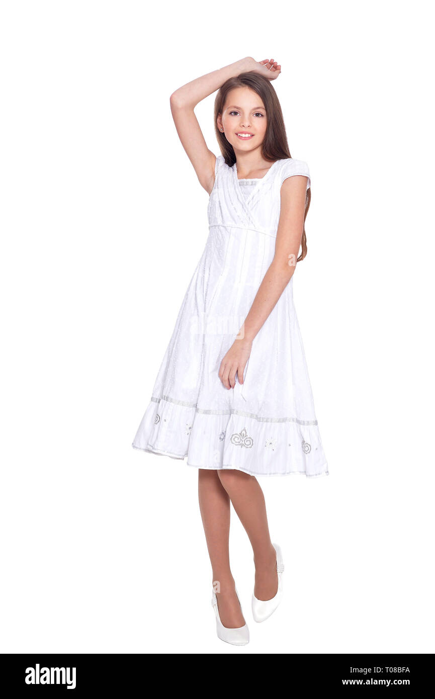 Portrait of beautiful girl in white dress posing Stock Photo - Alamy