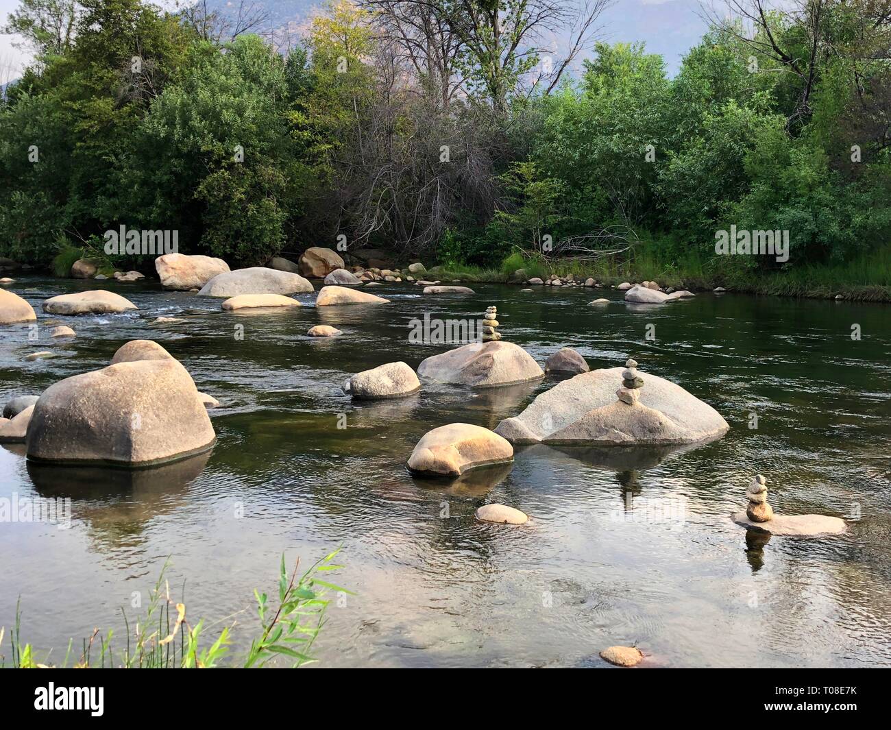 River view with stones piled on top of each other Stock Photo - Alamy