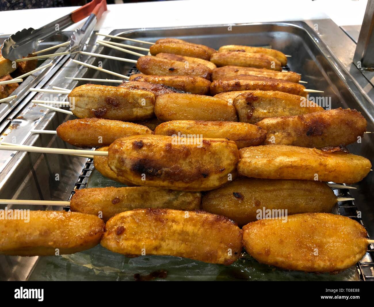 Banana cue is fried bananas on skewers coated with brown sugar Stock