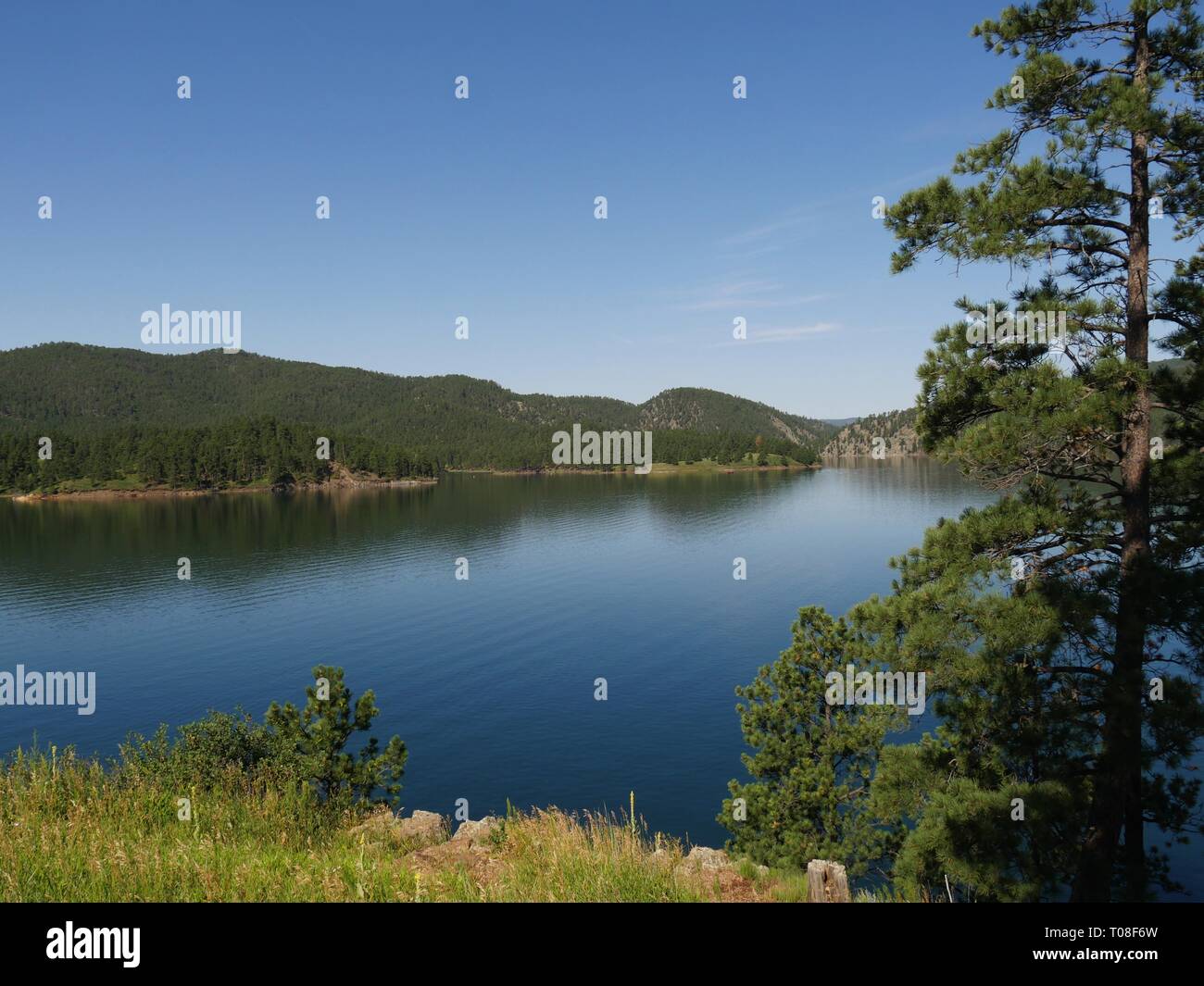 Beautiful view of Lake Pactola framed by trees at Black Hills, South