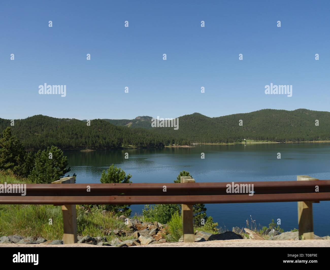 View of Lake Pactola framed the railings of the road, Black Hills