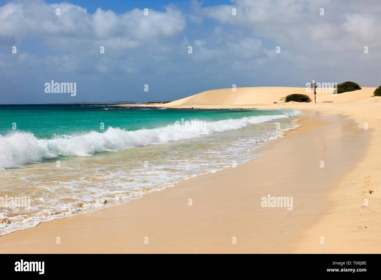 Atlantic waves crashing along shoreline of empty white sand beach with turquoise sea. Praia de Chaves, Rabil, Boa Vista, Cape Verde Islands, Africa Stock Photo
