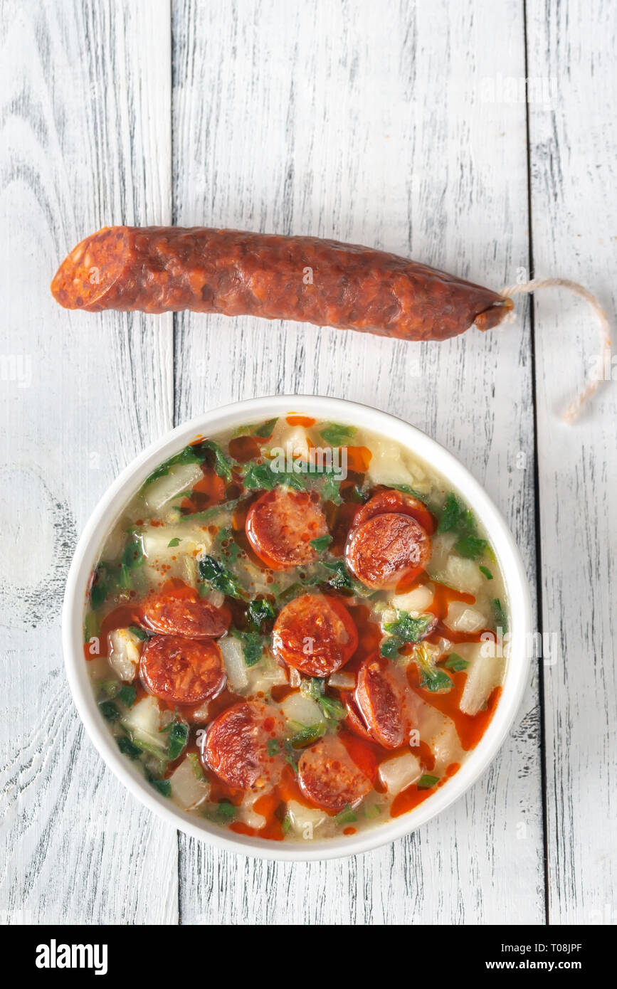 Portion of Portuguese Caldo verde soup with chorizo sausage Stock Photo